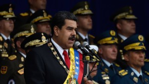 Venezuelan President Nicolas Maduro delivers a speech during a ceremony to celebrate the 81st anniversary of the National Guard in Caracas on August 4, 2018 day in which Venezuela's controversial Constituent Assembly marks its first anniversary. The Constituent Assembly marks its first anniversary on August 4 as the embodiment of Maduro's entrenchment in power despite an economic crisis that has crippled the country's public services and destroyed its currency. The assembly's very creation last year was largely responsible for four months of street protests that left some 125 people dead. / AFP PHOTO / Juan BARRETO